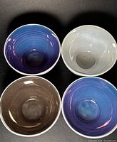 Top view showing four bowls with different metallic interior colours