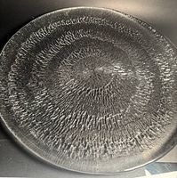 Full view of round textured glass serving plate