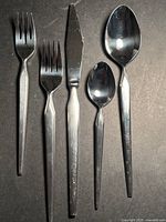 Example place setting showing fork, knife, tablespoon, teaspoon