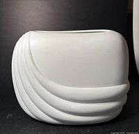 Front view of the white bisque Rosenthal vase showing wave ridges