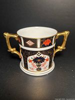 Front view showing Amari pattern and double gold handles