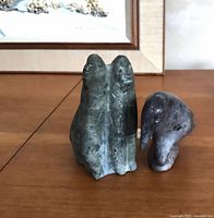 Front view of both carvings showing size and form