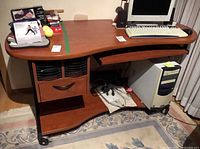 Front view of Liberty computer desk with monitor, keyboard tray, drawer, CD slots, CPU shelf
