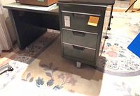 Desk front showing pedestal with three drawers