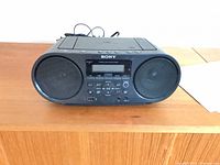 Front view of Sony ZS-RS60BT boombox on table