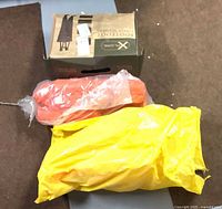 Boxed Xplore Bootfoot chest waders, orange PFD, yellow-bagged PFD