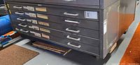 Front view of five-drawer metal flat file cabinet