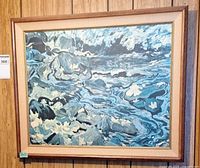 Full view of framed seascape painting on wood panel background