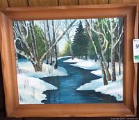 Full view of framed winter landscape painting