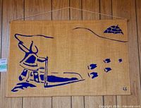 Full view of burlap wall hanging showing entire printed Inuit scene