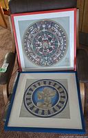 Overview of both framed calendar prints showing designs and frames