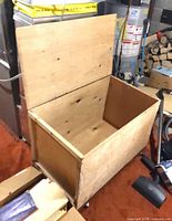 Chest open showing interior and casters