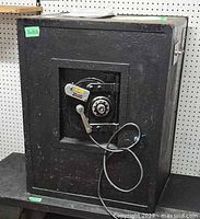 Full view of black Potter Electric SCV safe front