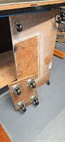 Both plywood dollies showing casters mounted