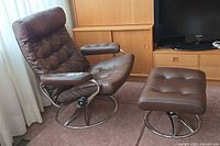 Full view of chair and ottoman showing design and condition