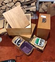 Three plywood boxes showing exterior and open interior