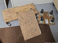 Three plywood dollies showing casters and size variation