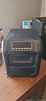 Front view of black Classic infrared quartz heater with control panel and grille