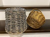 Grey and natural wicker baskets side by side on shelf