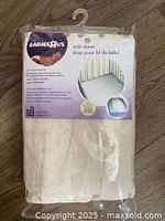 Front view of sealed Babies"R"Us crib sheet package