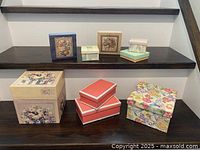 All nine gift boxes displayed on two shelves