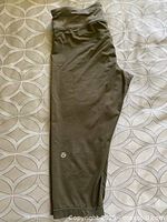 Full view folded capri pants showing length and color