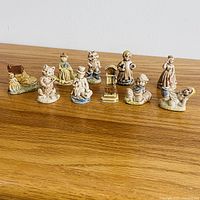 All 10 Wade nursery rhyme figurines lined up on tabletop