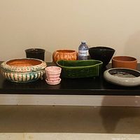 All eight planters on table