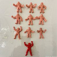 Front view of all 10 mini figures on surface