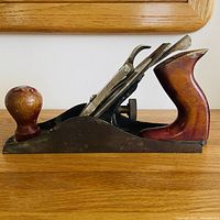 Side view of Corsair hand plane showing wooden knob, tote and metal body