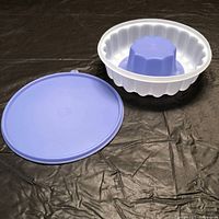 Three-piece mold set laid out showing body, insert, lid