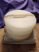 Round cake saver stacked on square cake saver