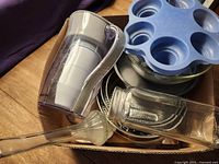 Boxed lot showing ZeroWater pitcher, silicone mold, glass vase, stainless springforms