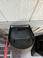 Close view of mailbox lid showing US Mail embossing