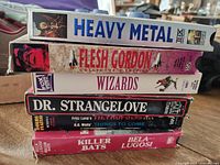 Stack of six VHS tapes showing spines and titles