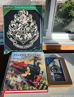 Front view showing plaque box, illustrated book and collectible tin