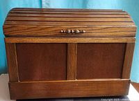 Front view of closed wooden chest
