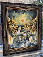 Front view of framed painting showing entire artwork and signature