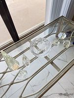 Top view of all seven clear glass pieces on table
