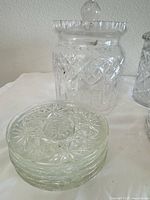 Waterford Lismore biscuit barrel and stack of starburst coasters