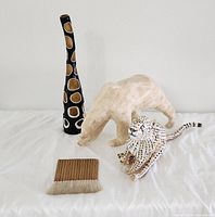 Overall view showing vase, polar bear, cheetah figurine and brush