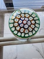 Overhead close-up of millefiori pattern in paperweight