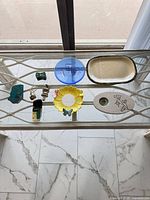 All nine items arranged on glass surface