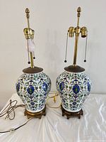 Pair of porcelain Oriental style gourd form table lamps overall view