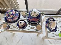 Full view of all earthenware pieces on glass table