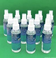 Front view of all 12 Bioesque disinfectant spray bottles