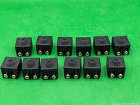 Group shot of 12 identical push-button switches
