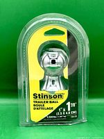 Front of packaged Stinson trailer ball showing size and capacity