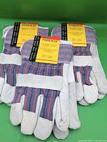 Three pairs Toolway leather work gloves with tags front view