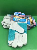 Front view of three tagged pairs of gloves